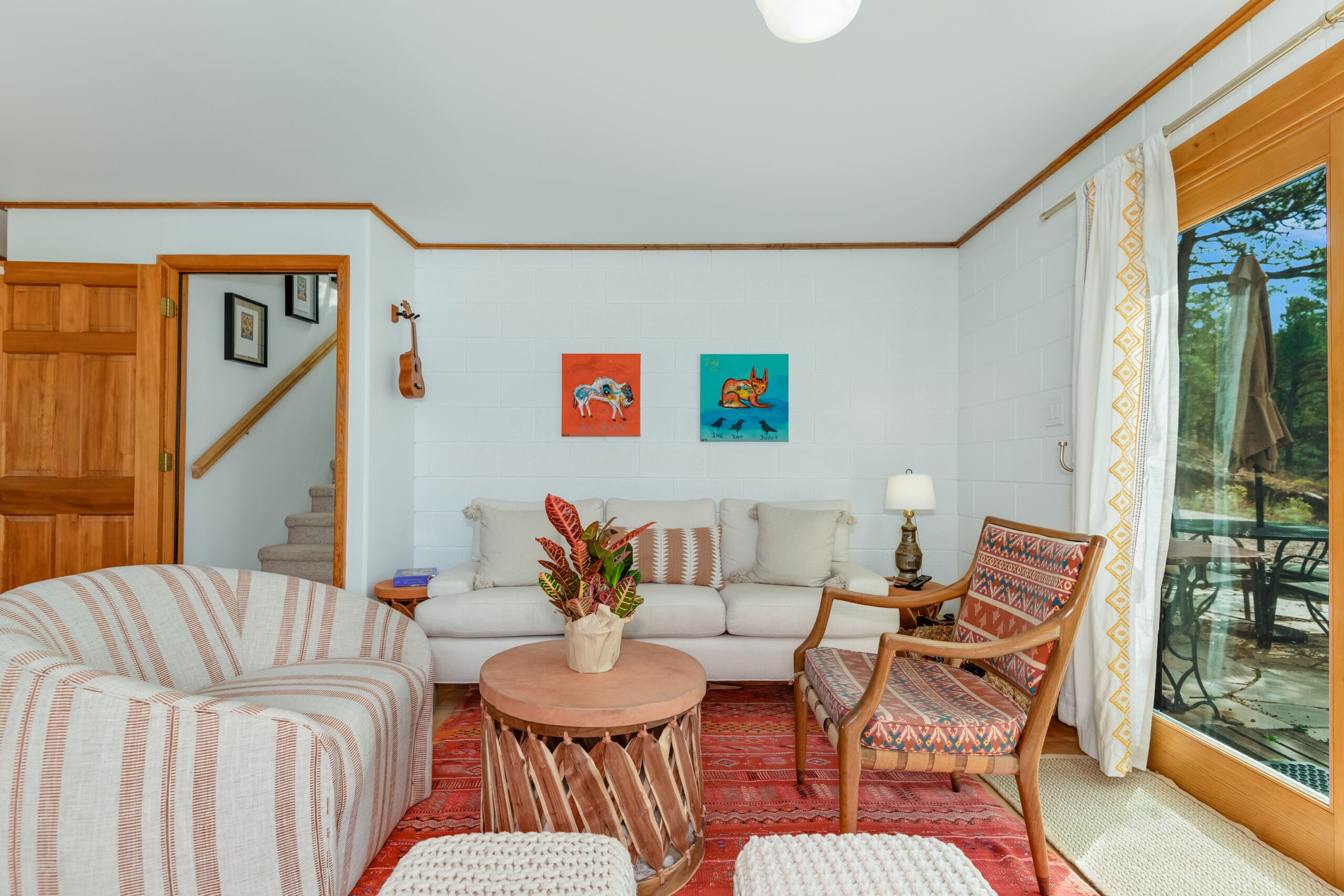 Cozy living room featuring a couch, a chair, and a table arranged for relaxation and socializing