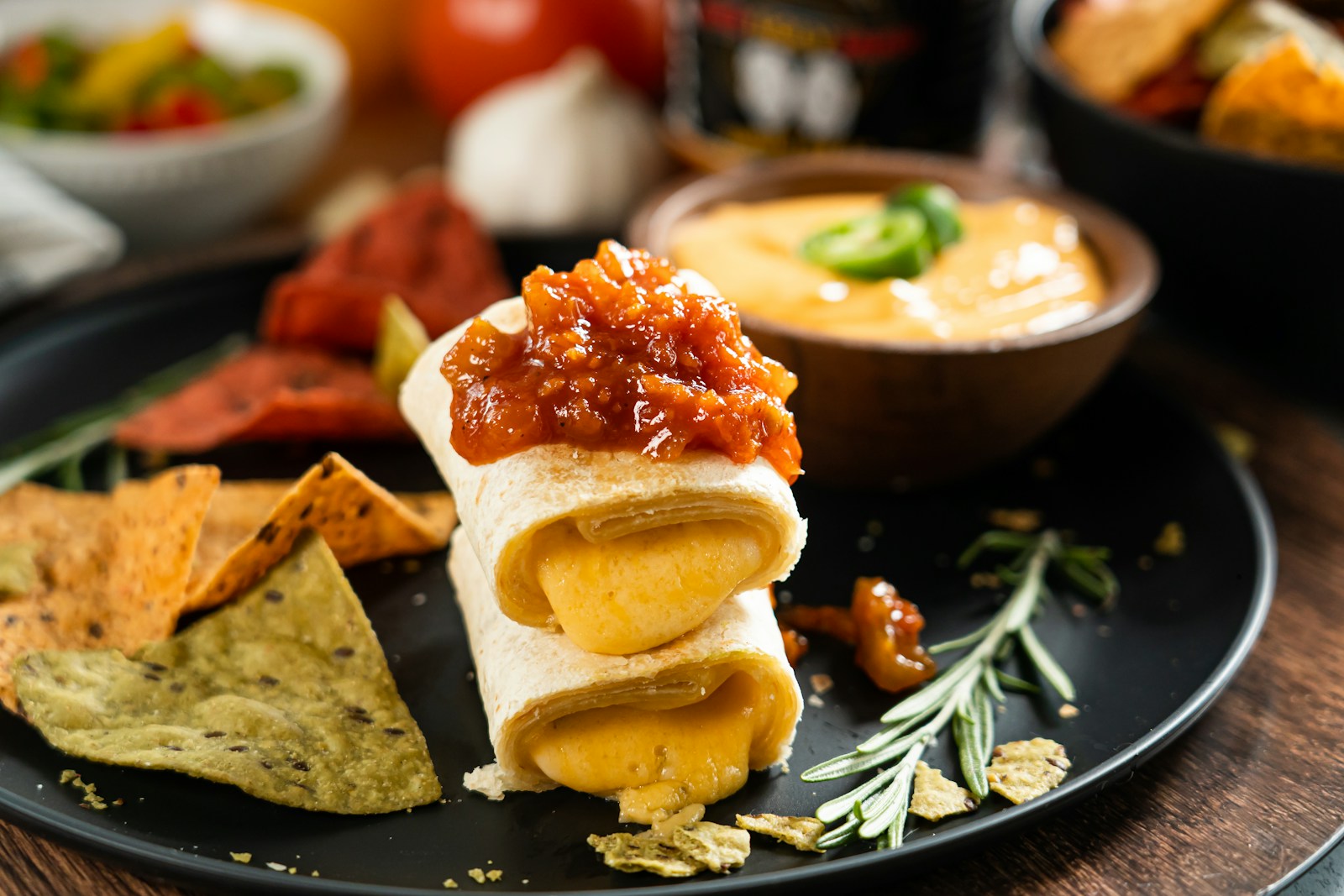 a black plate topped with lots of food